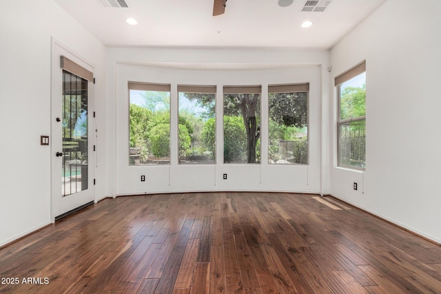 30135 N 129th Gln, Peoria, AZ 85383 - empty room featuring plenty of natural light, dark wood-style flooring, a ceiling fan, and recessed lighting