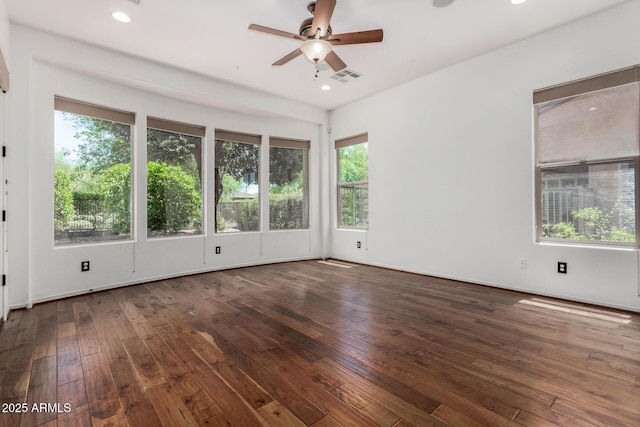 30135 N 129th Gln, Peoria, AZ 85383 - empty room with plenty of natural light, a ceiling fan, hardwood / wood-style floors, and recessed lighting