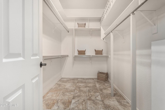 30135 N 129th Gln, Peoria, AZ 85383 - spacious closet featuring stone finish flooring