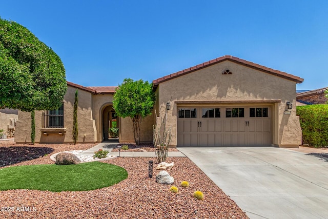 30135 N 129th Gln, Peoria, AZ 85383 - mediterranean / spanish-style home featuring an attached garage, stucco siding, concrete driveway, and a tile roof