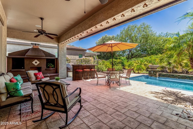 30135 N 129th Gln, Peoria, AZ 85383 - view of patio with ceiling fan and an outdoor living space with a fireplace