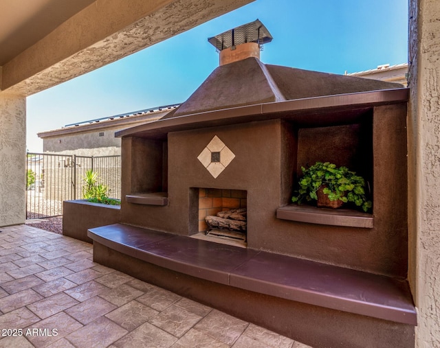 30135 N 129th Gln, Peoria, AZ 85383 - view of patio / terrace featuring a tiled fireplace
