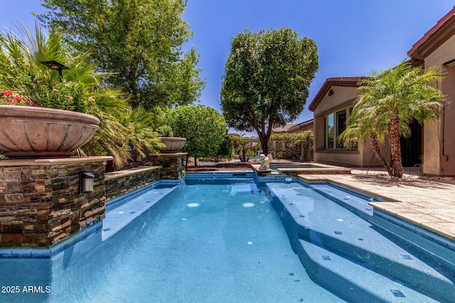 30135 N 129th Gln, Peoria, AZ 85383 - view of swimming pool with a pool with connected hot tub and a patio area
