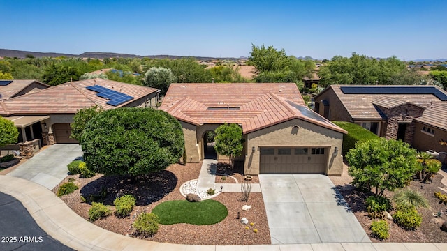 30135 N 129th Gln, Peoria, AZ 85383 - view of front of house with an attached garage, driveway, stucco siding, and a tile roof