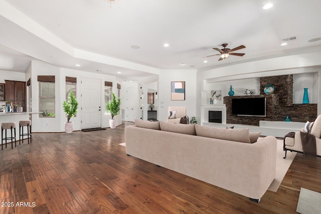 30135 N 129th Gln, Peoria, AZ 85383 - living room featuring recessed lighting, dark wood-type flooring, ceiling fan, and a fireplace