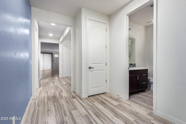 corridor featuring light wood-type flooring