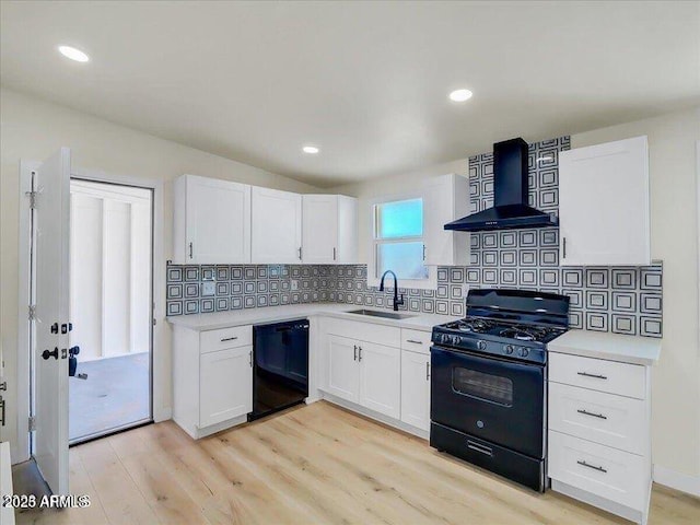 3650 E Laurel Ln, Phoenix, AZ 85028 - kitchen featuring black appliances, wall chimney range hood, a sink, light countertops, and white cabinets