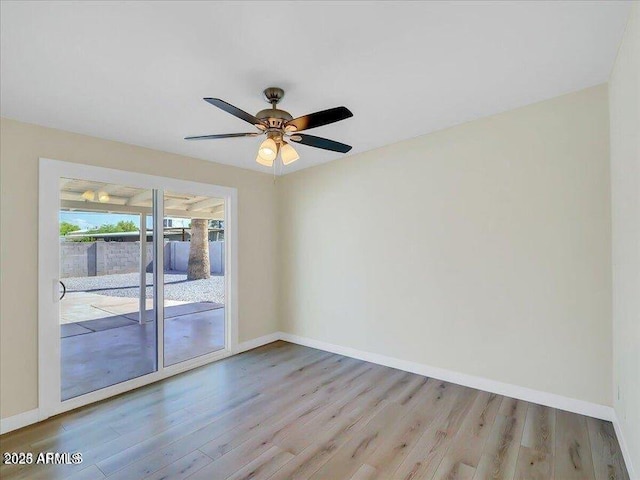 3650 E Laurel Ln, Phoenix, AZ 85028 - spare room with wood finished floors, baseboards, and a ceiling fan