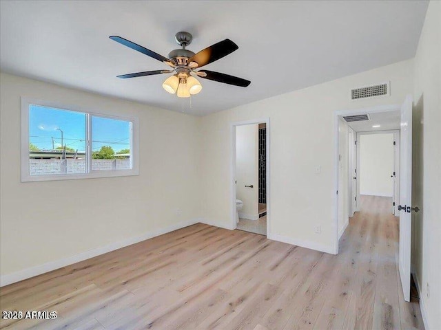 3650 E Laurel Ln, Phoenix, AZ 85028 - empty room featuring light wood-style floors, baseboards, and a ceiling fan
