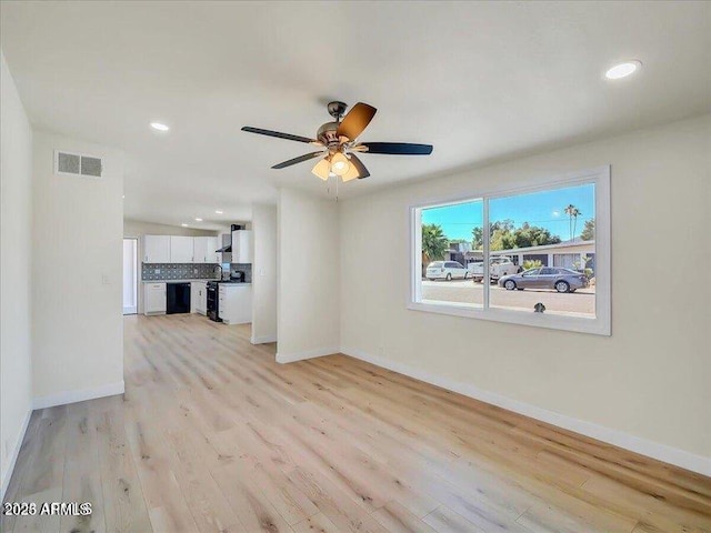 3650 E Laurel Ln, Phoenix, AZ 85028 - unfurnished living room featuring light wood finished floors, baseboards, recessed lighting, and ceiling fan