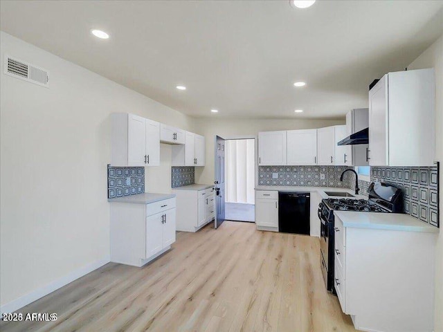 3650 E Laurel Ln, Phoenix, AZ 85028 - kitchen featuring black appliances, under cabinet range hood, backsplash, light wood finished floors, and a sink