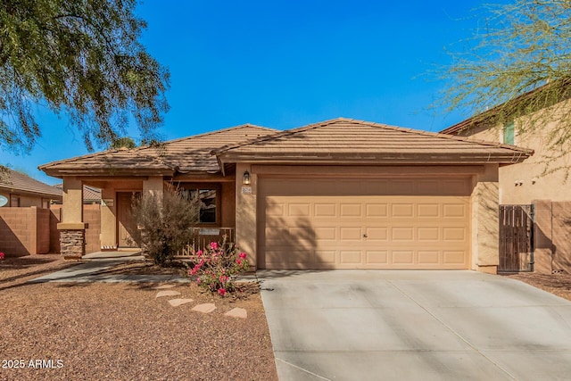 view of front of home with driveway, a tiled roof, and stucco siding