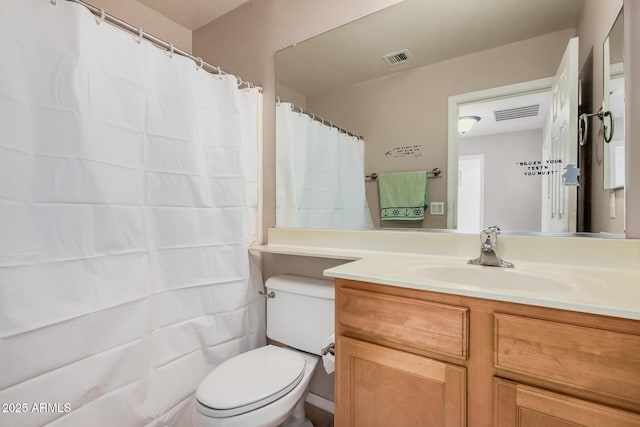 full bathroom with visible vents, vanity, and toilet