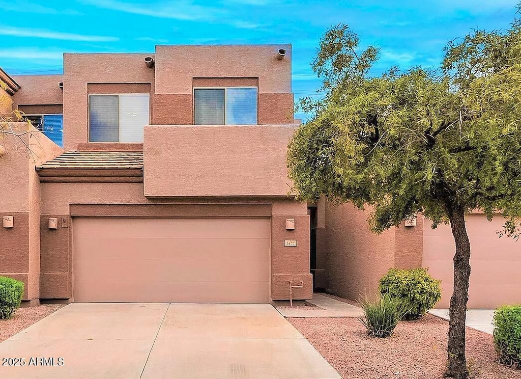 1477 W Marlin Dr, Chandler, AZ 85286 - view of front of house featuring an attached garage, stucco siding, and concrete driveway