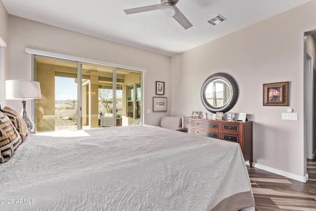 bedroom featuring visible vents, a ceiling fan, wood finished floors, baseboards, and access to exterior