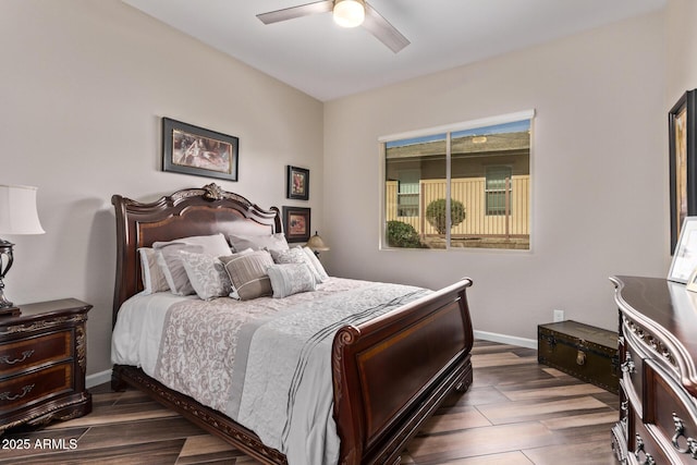 bedroom with a ceiling fan, baseboards, and dark wood-style flooring