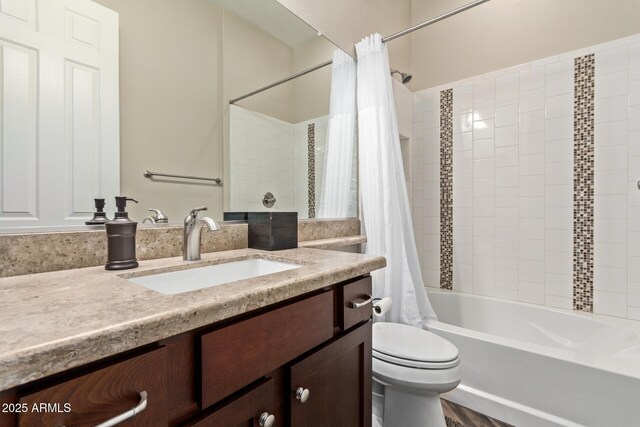 full bathroom with vanity, toilet, and shower / tub combo with curtain