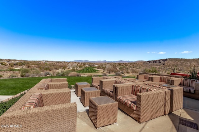 view of patio / terrace with outdoor lounge area and a mountain view