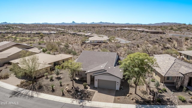 bird's eye view with a desert view and a mountain view