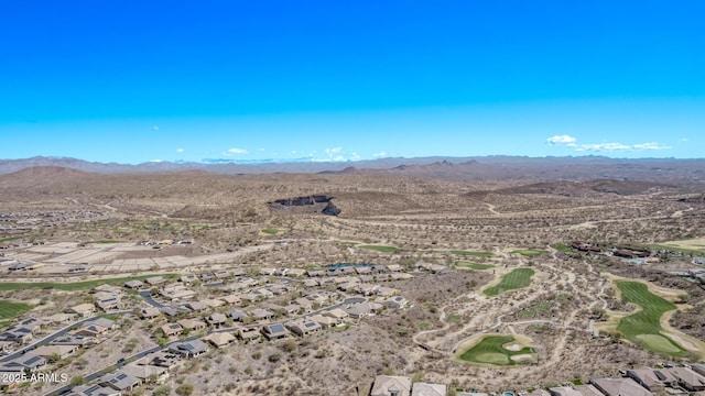 birds eye view of property with a mountain view