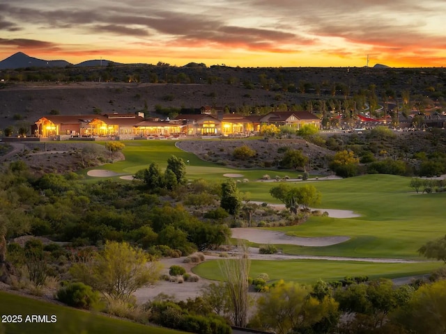 surrounding community featuring a yard and view of golf course