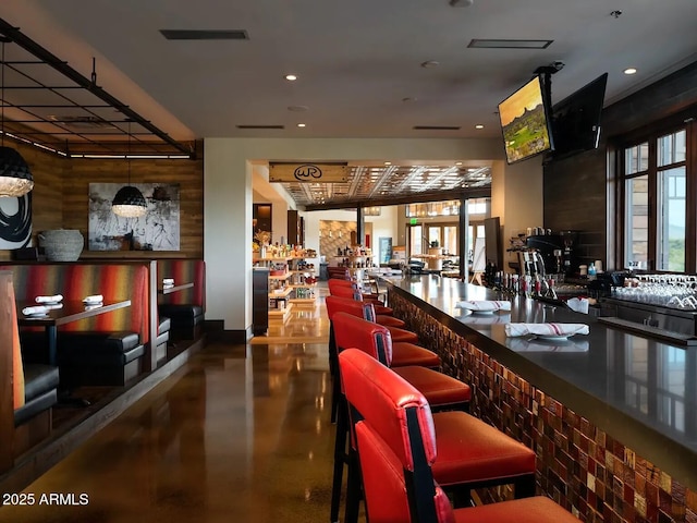 bar featuring a dry bar, recessed lighting, visible vents, and concrete floors