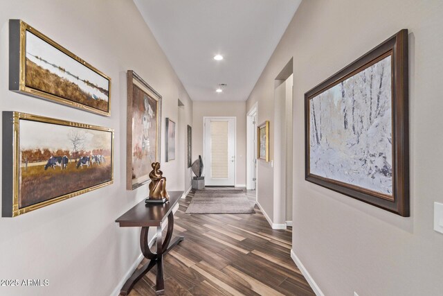 hallway with recessed lighting, baseboards, and dark wood finished floors