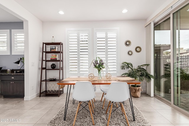 dining space with breakfast area and light tile patterned flooring