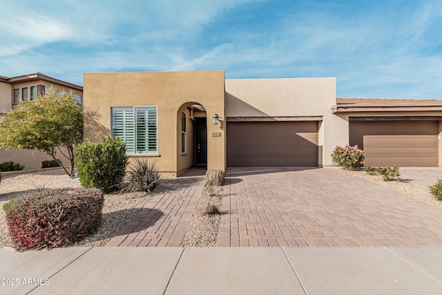 adobe home featuring a garage