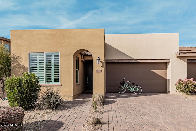 southwest-style home with a garage