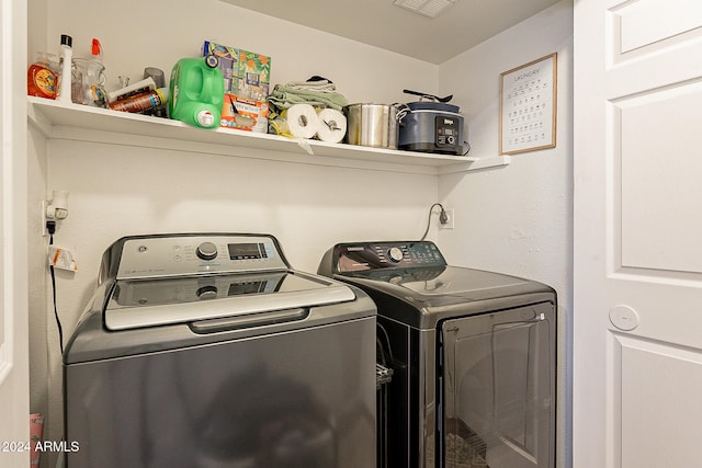 laundry area with separate washer and dryer