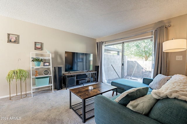 carpeted living room featuring a textured ceiling