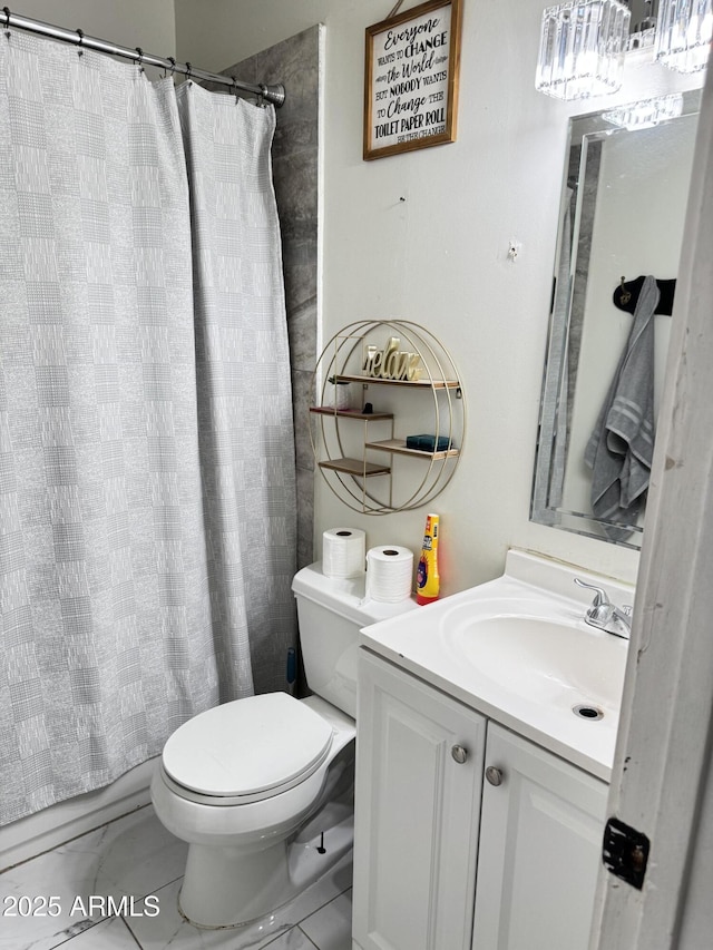 bathroom with shower / bath combo with shower curtain, toilet, marble finish floor, and vanity