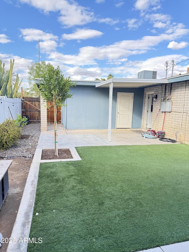 view of yard with a patio and fence