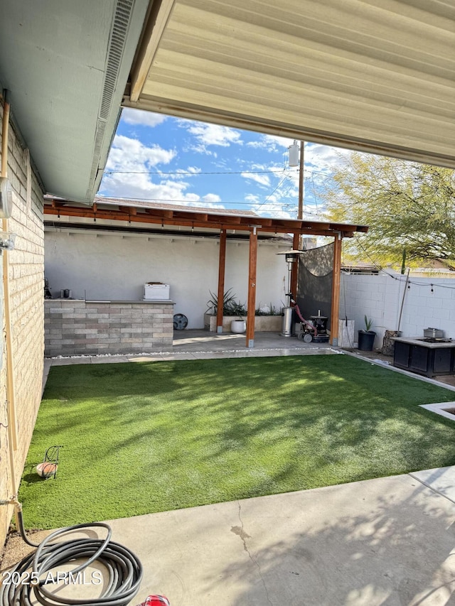 view of yard with fence and a patio area