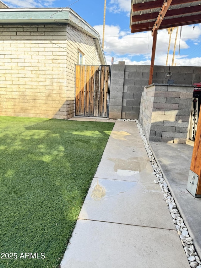 view of yard featuring a gate and fence