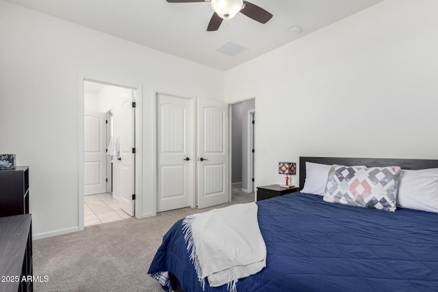 2562 N Springfield St, Buckeye, AZ 85396 - bedroom featuring carpet floors, ensuite bath, a ceiling fan, and baseboards