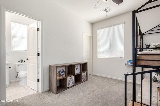 2562 N Springfield St, Buckeye, AZ 85396 - bedroom with carpet, connected bathroom, and baseboards