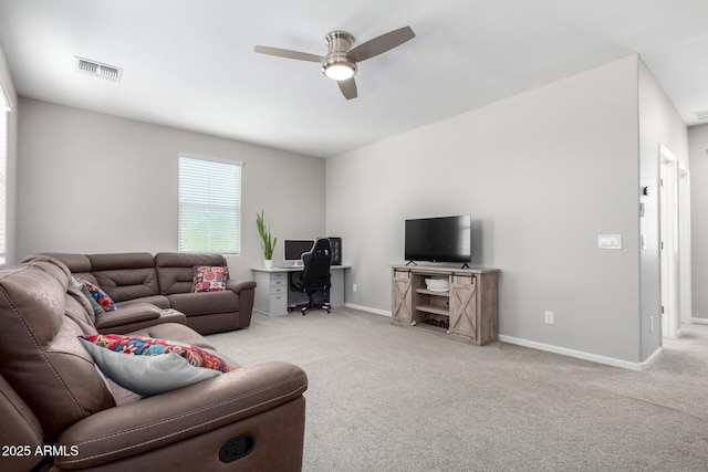 2562 N Springfield St, Buckeye, AZ 85396 - carpeted living room with a ceiling fan, baseboards, and a desk