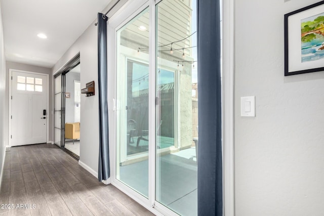 2562 N Springfield St, Buckeye, AZ 85396 - entryway with dark wood-type flooring, baseboards, and recessed lighting