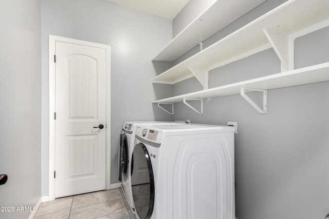 2562 N Springfield St, Buckeye, AZ 85396 - laundry room featuring independent washer and dryer, baseboards, and light tile patterned floors