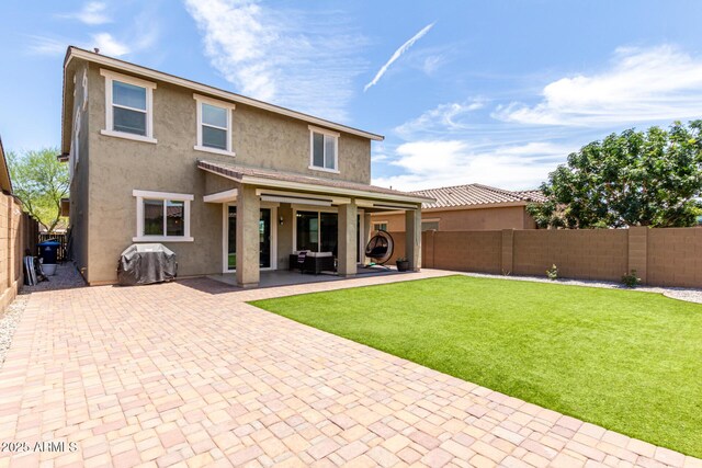 2562 N Springfield St, Buckeye, AZ 85396 - back of house with stucco siding and a patio area