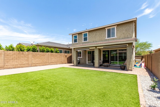 2562 N Springfield St, Buckeye, AZ 85396 - rear view of house with stucco siding and a patio area