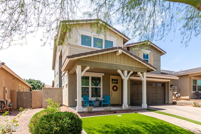2562 N Springfield St, Buckeye, AZ 85396 - view of front facade featuring covered porch, a gate, driveway, and stucco siding