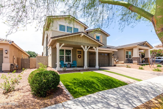 2562 N Springfield St, Buckeye, AZ 85396 - craftsman inspired home with covered porch, a gate, driveway, stucco siding, and board and batten siding