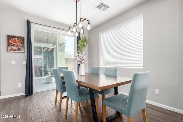 2562 N Springfield St, Buckeye, AZ 85396 - dining area with dark wood-type flooring and baseboards