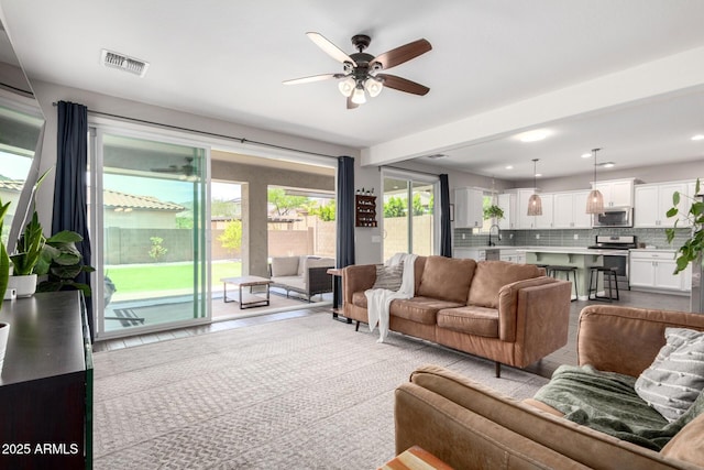 2562 N Springfield St, Buckeye, AZ 85396 - living area featuring a ceiling fan