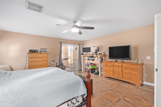 bedroom with tile patterned flooring and ceiling fan