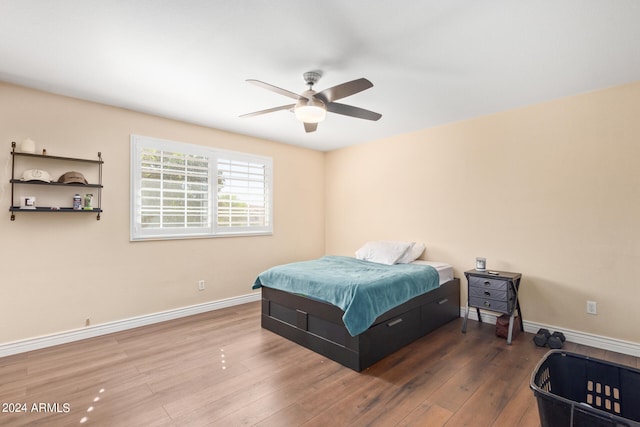 bedroom featuring hardwood / wood-style flooring and ceiling fan