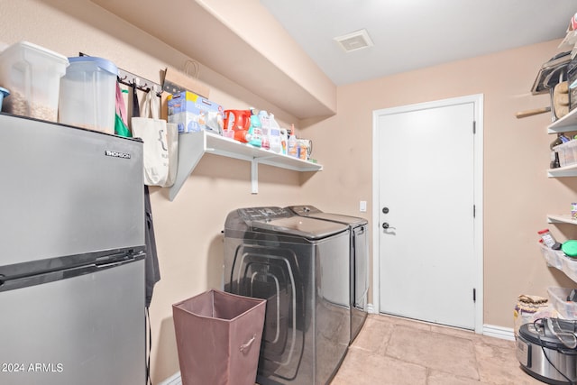 laundry room featuring washer and clothes dryer